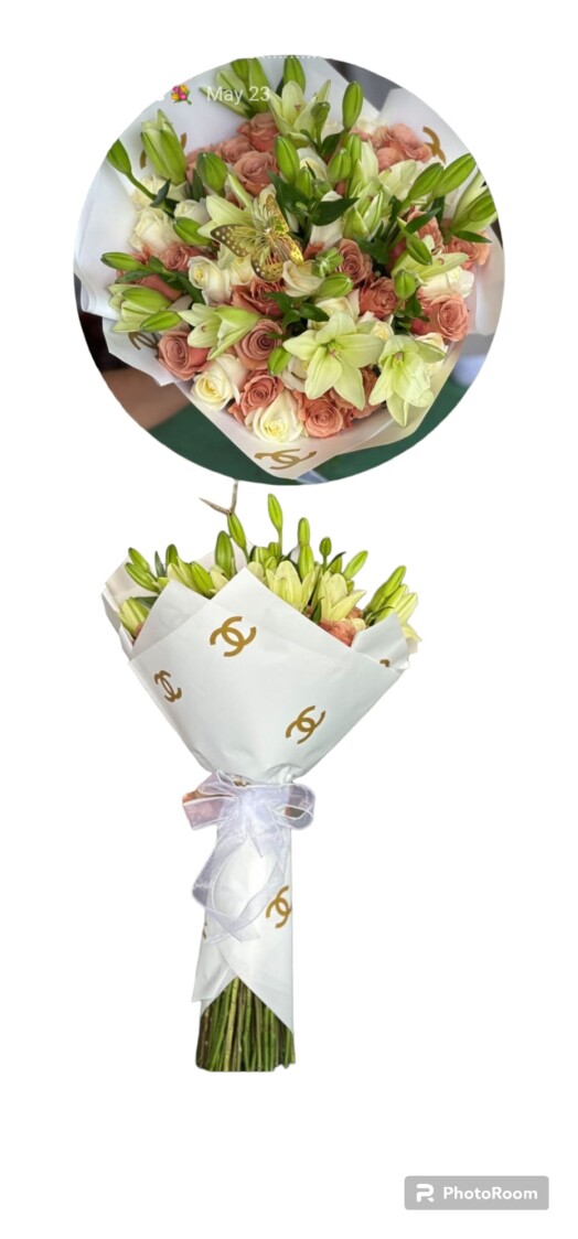 A bouquet of flowers with chanel logo on it.