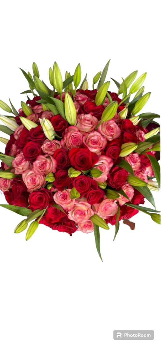 A bouquet of roses and lilies in red