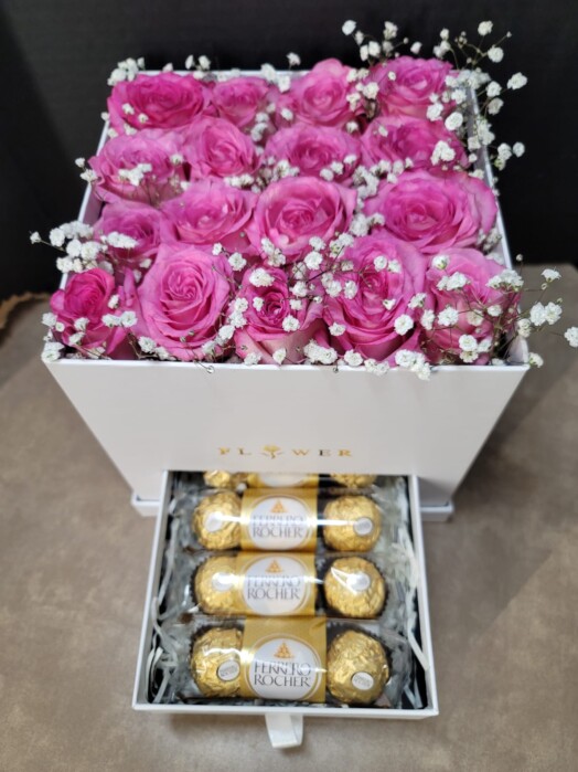 A box of roses and chocolates in it